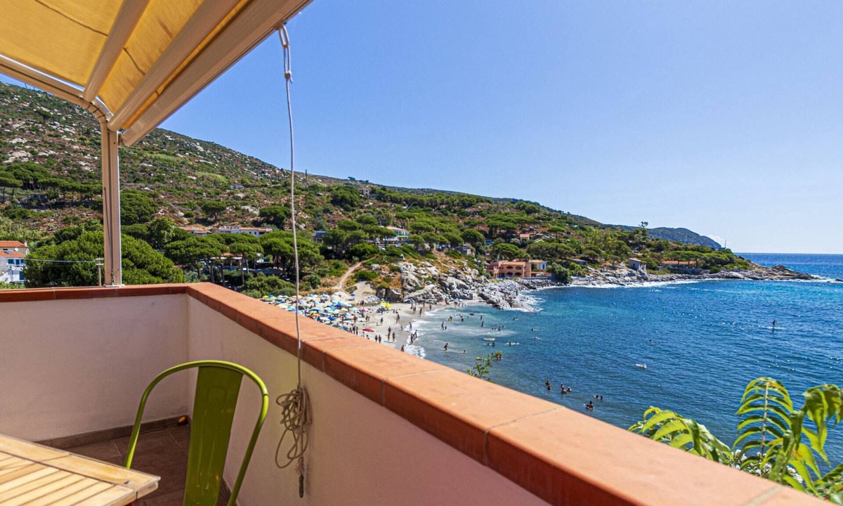 Seccheto Apartment | Camilla, a three-room apartment in Seccheto with a splendid sea view, a small balcony equipped with