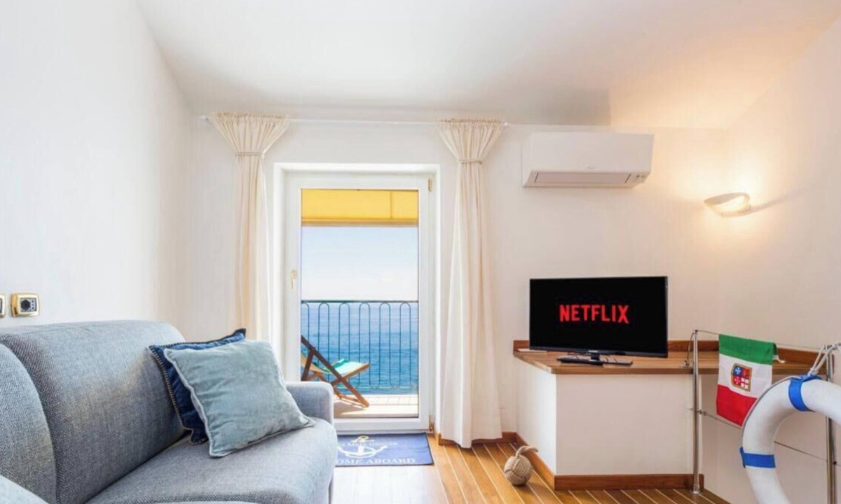 Nervi Apartment | “Vista Mare Genova”A two-level gem with a spectacular sea view, unique in the area.Lower floor: Bedroom with premium-quality mattress, bathroom, and a cozy corner with table and chess set overlooking the sea.Upper floor: Living room with sofa bed, fu