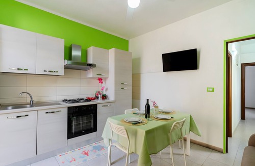 Torre Lapillo Apartment | Apartment 'Due Passi Dal Mare Primo Piano' with Sea View, Shared Terrace and Air Conditioning