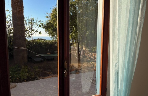Porto Alabe Apartment | Apartment in a villa under a large palm tree and garden