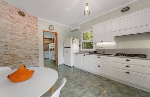 Buggerru House | Buggerru Hugo Holiday Home with Sea View, Private Terrace and Air Conditioning