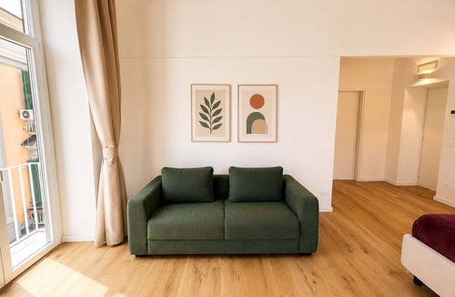 Montecalvario Apartment | Family & Friends Wing at Penthouses Dante. Private wing for groups: 35sqm kitchen/lounge, 3 ensuite bedrooms—30sqm Suite with balcony on Piazza Dante, 20sqm Superior, and a Double room. Access to panoramic rooftop over historic center's ancient domes.