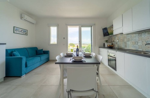 Pachino Apartment | GuestHost - Charming 75 sqm seaview apartment on two levels, for 5 people, located inside the renowned Borgo 84 residence, equipped with swimming pool and cycle path. The property is located just 3 km from the center of Marzamemi, one of the most fascina