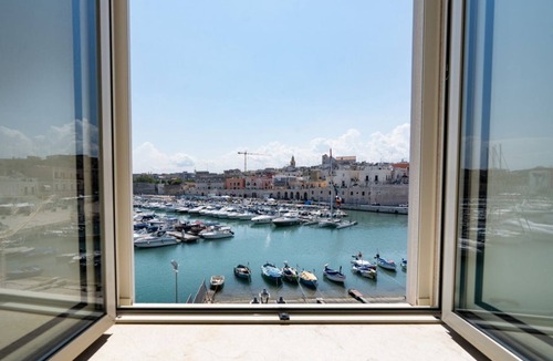 Bisceglie Apartment | GuestHost - Cozy 40 sqm ground floor apartment, perfect for two people.The property offers enchanting views of the sea and the port of Bisceglie and is perfectly located for exploring the city's most charming attractions. All main amenities and the neare