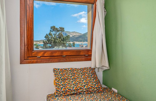 Baia Caddinas House | Holiday Home 'Orizzonti 33' with Sea View, Private Terrace and Air Conditioning
