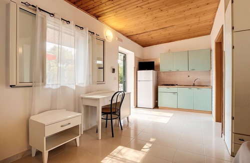 Chiesiola Resort | Property in a Holiday Village 'Baia Falcone - Comfort 210' with Sea View and Air Conditioning