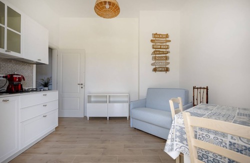 Monti D'arena-Bosco Caggione Apartment | This cozy apartment, perfect for two people, is located in a shared villa but has its own private access. It features a shared garden and a large furnished patio for exclusive use. The accommodation is located in Marina di Pulsano, a well-served seaside