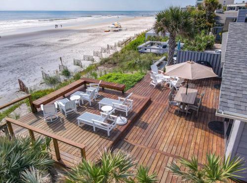 Beachfront Deck with steps down to the white sandy beach Sea Dunes Sandcastle 1A in Edgewater