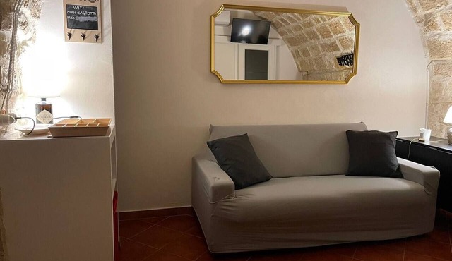 Grotta Paradiso, a two-story stone cottage with a warm and cozy charm.