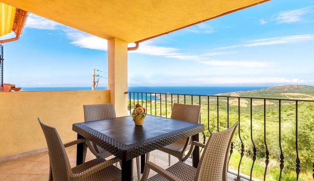 Sea View Isola Rossa Apartment with Sea View, Wi-Fi, and Air Conditioning