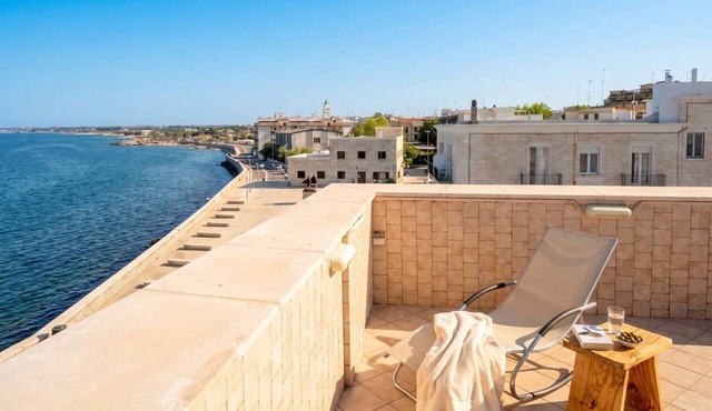 Seafront Retreat with Private Rooftop Terrace